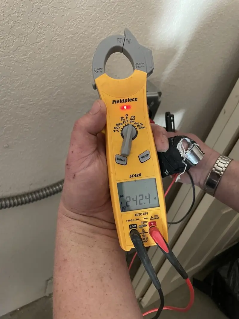 Voltage testing with clamp meter during Outlet Installation in Erda